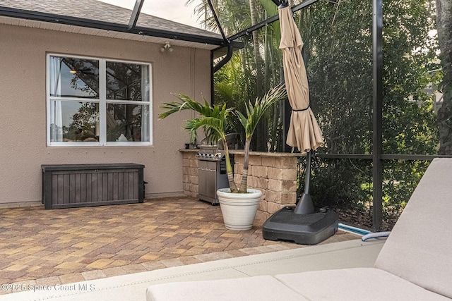 view of patio with radiator and glass enclosure