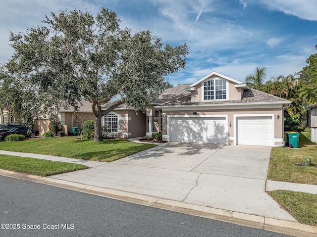 front of property with a garage and a front lawn