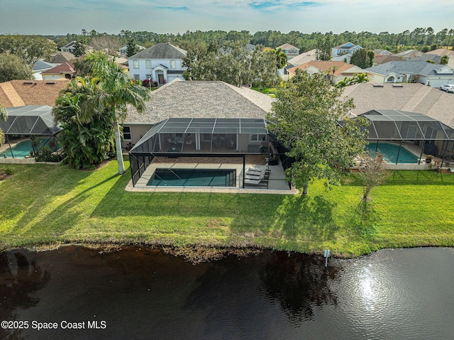 birds eye view of property with a water view