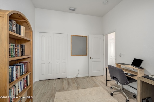 office space with light hardwood / wood-style flooring