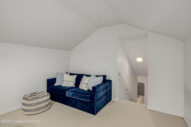 living area with vaulted ceiling and carpet floors