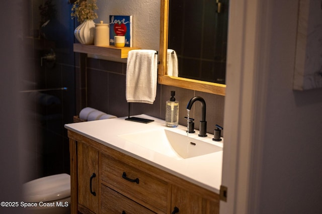 bathroom with vanity and toilet