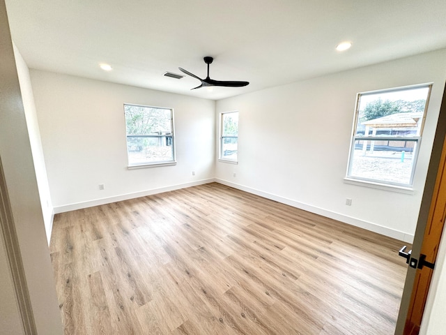 unfurnished room with light hardwood / wood-style flooring and ceiling fan