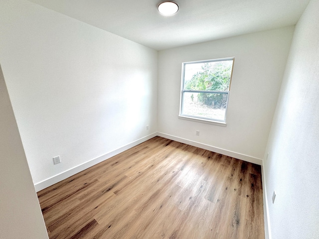 spare room with light hardwood / wood-style floors