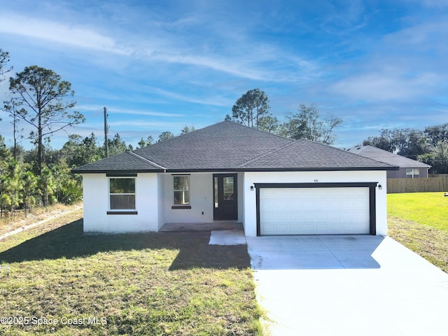 ranch-style home with a garage and a front lawn