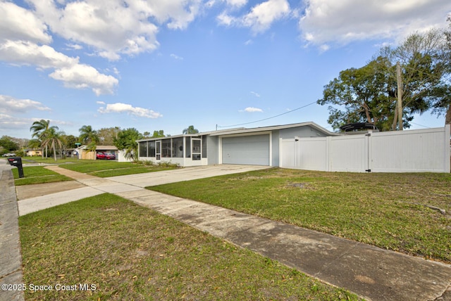 view of front of house featuring a garage and a front lawn