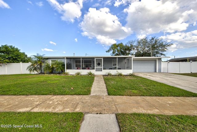 ranch-style house with a garage, a sunroom, and a front lawn