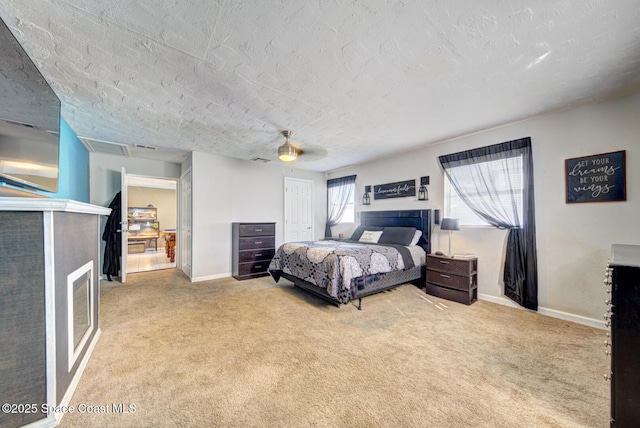 carpeted bedroom featuring ceiling fan, a closet, and a textured ceiling