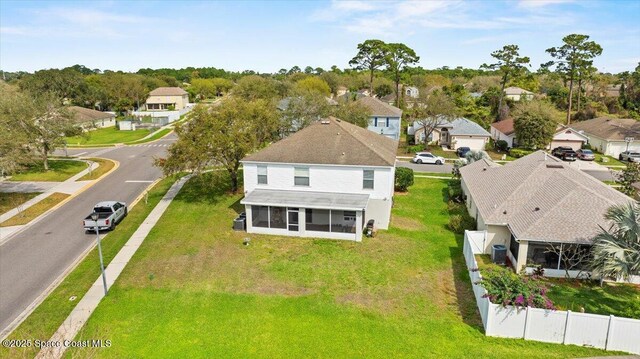 birds eye view of property with a residential view