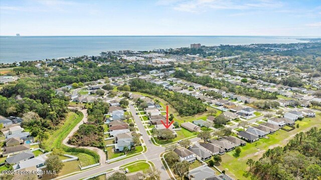 bird's eye view with a water view and a residential view