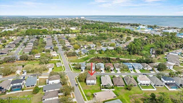 bird's eye view with a residential view and a water view