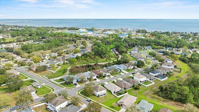 bird's eye view featuring a residential view and a water view