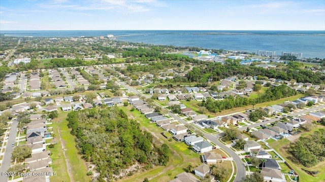 aerial view with a water view and a residential view