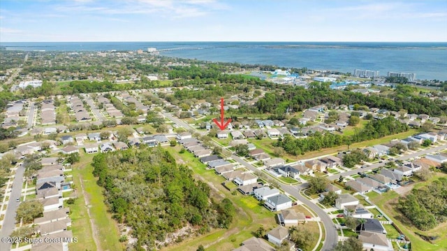 birds eye view of property featuring a water view and a residential view