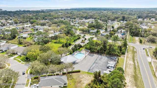 birds eye view of property with a residential view