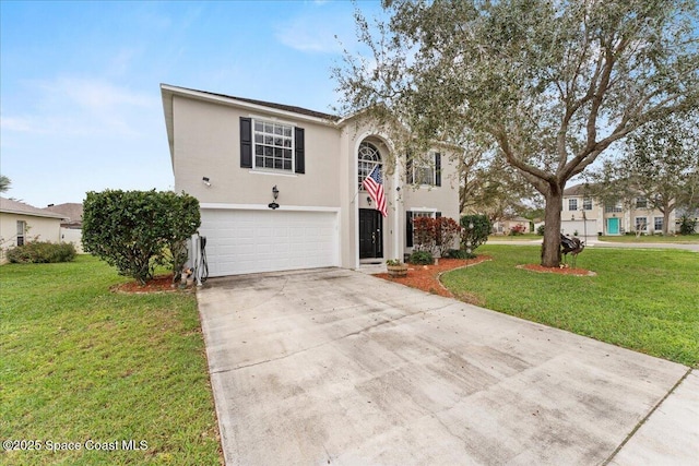 view of front of property with an attached garage, concrete driveway, a front yard, and stucco siding