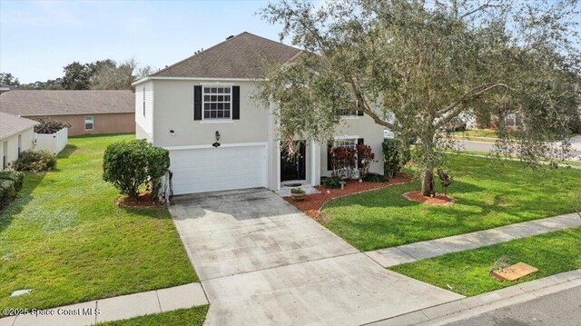 view of front of property with a garage, a front yard, concrete driveway, and stucco siding