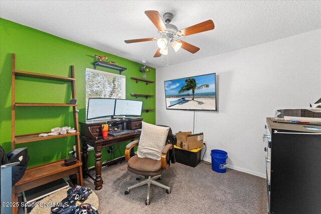 office with baseboards, carpet, a ceiling fan, and a textured ceiling