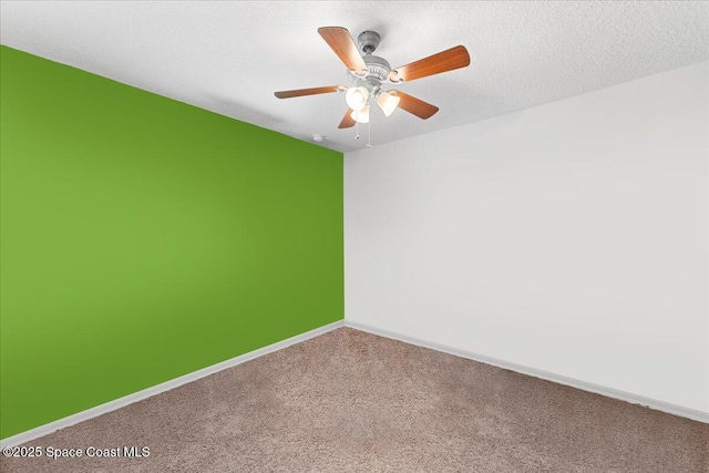 unfurnished room with carpet floors, a textured ceiling, baseboards, and a ceiling fan