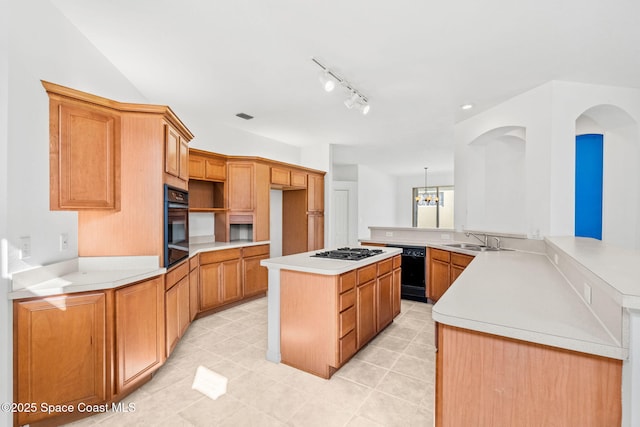 kitchen with sink, a notable chandelier, black appliances, a kitchen island, and kitchen peninsula