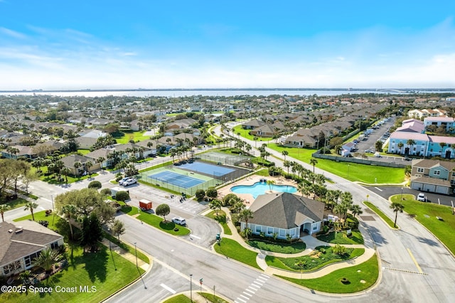 birds eye view of property with a water view