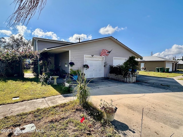 view of front of property with a garage and a front yard