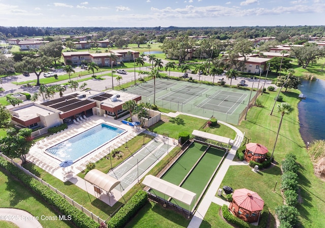 birds eye view of property with a water view