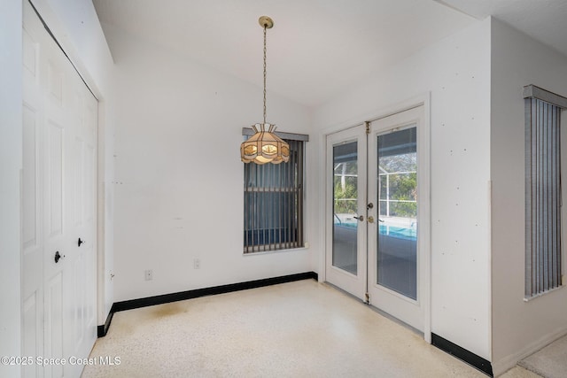 interior space with french doors and vaulted ceiling