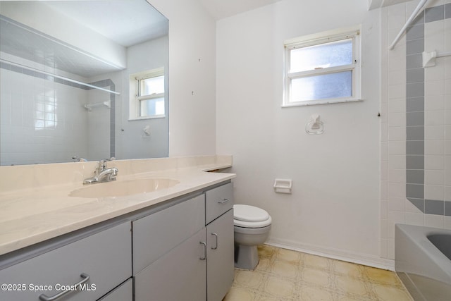 full bathroom featuring vanity, toilet, and tiled shower / bath combo