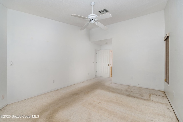 unfurnished room with light carpet and ceiling fan