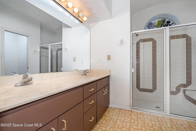 bathroom featuring vanity and an enclosed shower