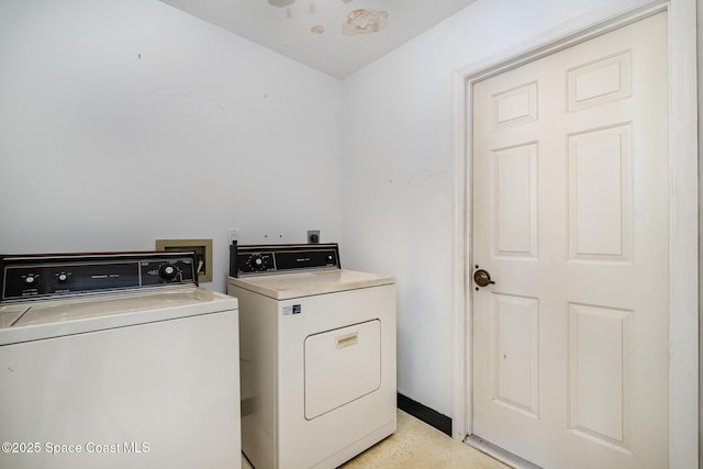 washroom featuring independent washer and dryer