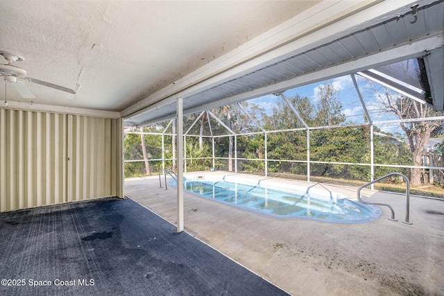 view of pool featuring a lanai, a patio area, and ceiling fan