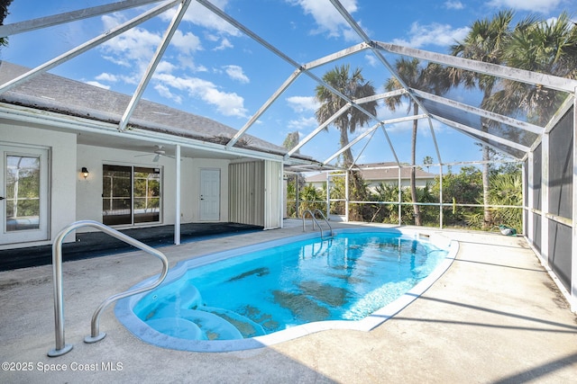 view of swimming pool with a patio and a lanai