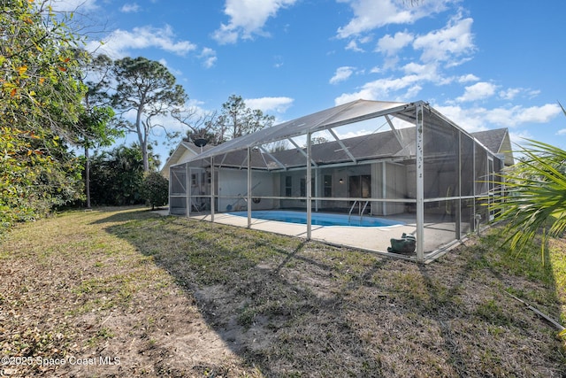 view of pool featuring a yard and a patio area