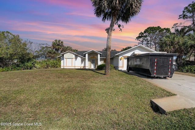 view of front of property with a yard