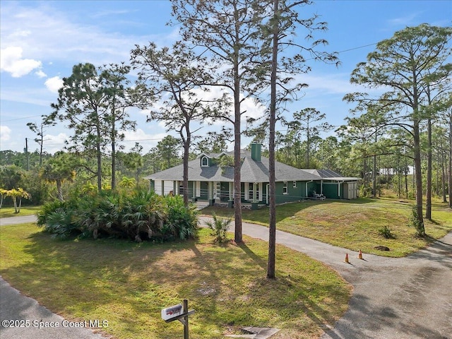 ranch-style home with a front yard