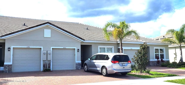 single story home featuring a garage