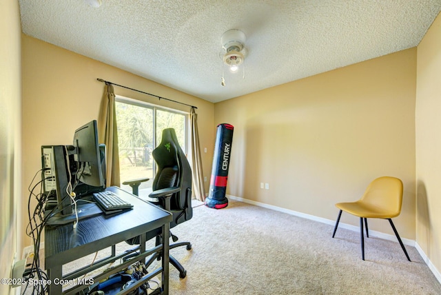 office area featuring a textured ceiling and carpet