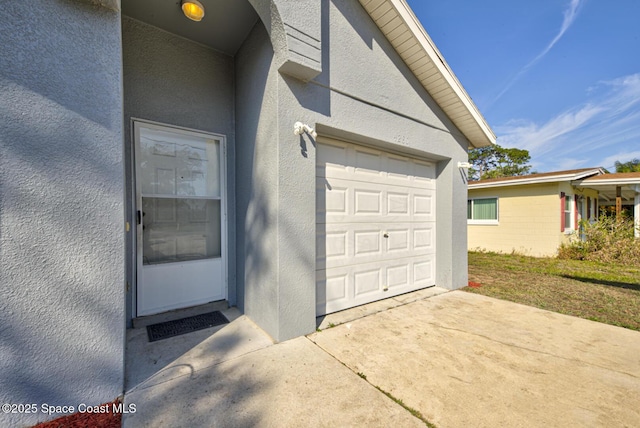 property entrance featuring a garage