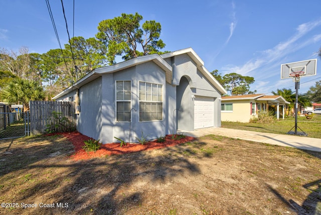 view of front of property featuring a garage and a front lawn