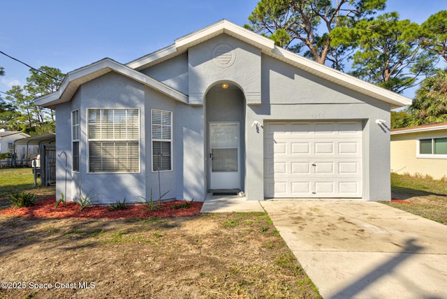 ranch-style home featuring a carport, a garage, and a front yard