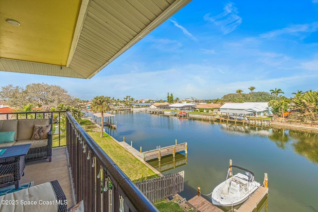 balcony featuring an outdoor hangout area and a water view