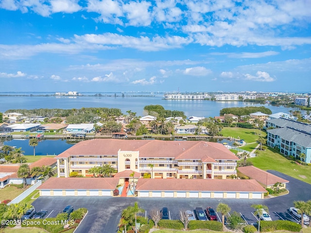 birds eye view of property featuring a water view