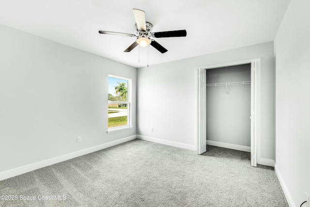 unfurnished bedroom with light carpet, ceiling fan, and a closet