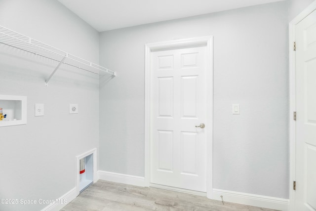 laundry room featuring washer hookup, hookup for an electric dryer, and light hardwood / wood-style floors