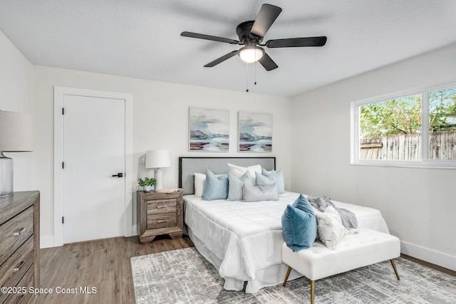 bedroom featuring wood-type flooring and ceiling fan