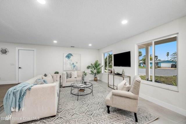 living room with a textured ceiling