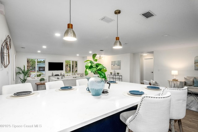 dining area with hardwood / wood-style floors