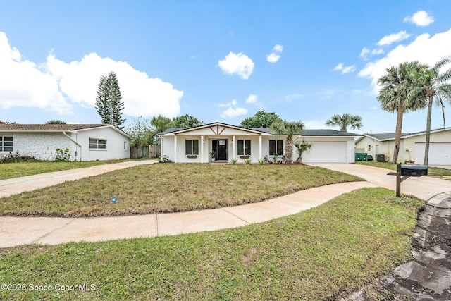 ranch-style home featuring a garage and a front lawn